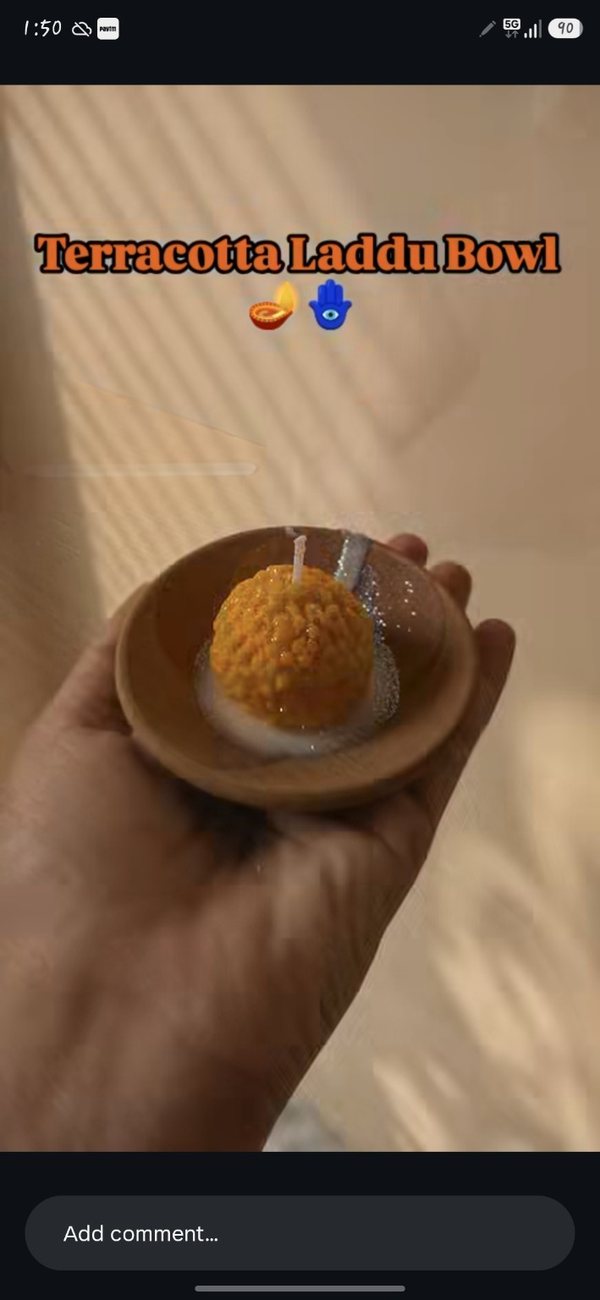 Terracotta bowl with laddu candle